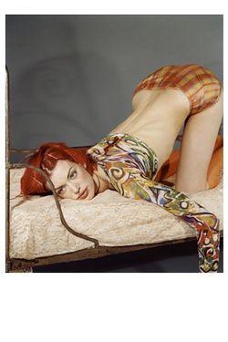 Red-haired woman in the knee-chest position.