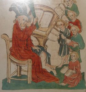 Medieval illustration of a school birching.