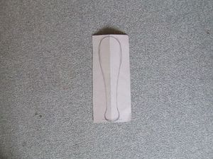 The paddle sketched on the cardboard.