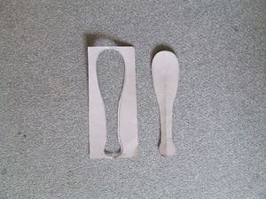 The cardboard stencil. Either the negative or the positive form can be used.