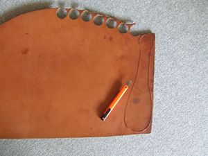 Cutting the paddle from the leather.